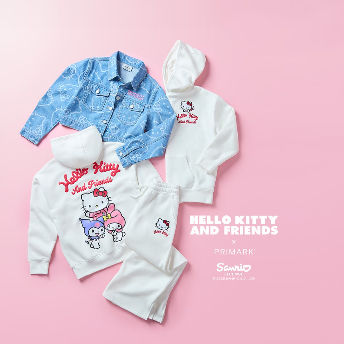 A flat lay of a white hello kitty hoodie and denim jacket 