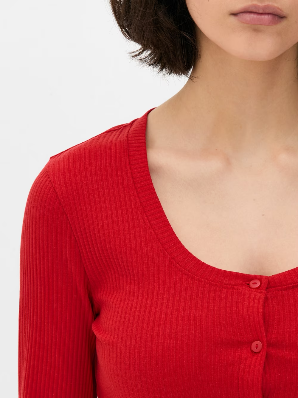 woman wearing Ribbed Crop Cardigan in red