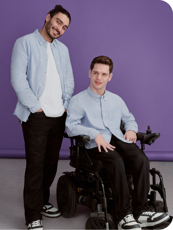 Two models wearing a blue shirt with black jeans