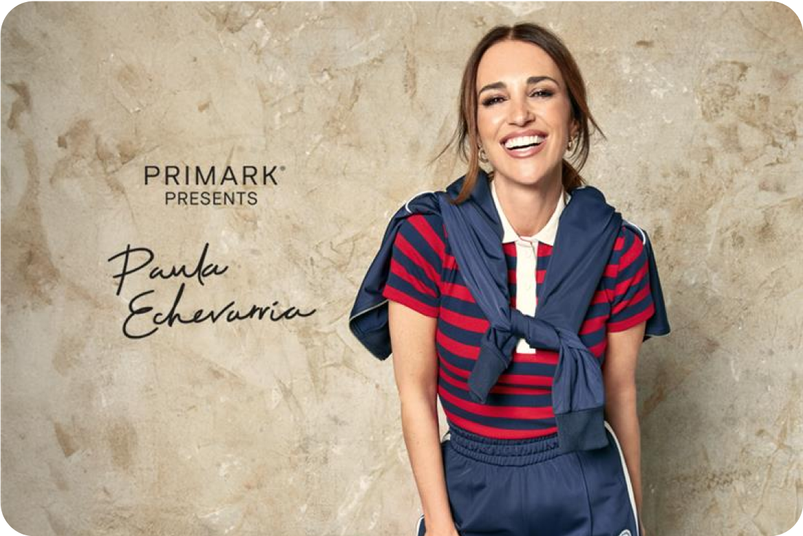  Paula Echevarría wearing a red and blue polo and navy trousers