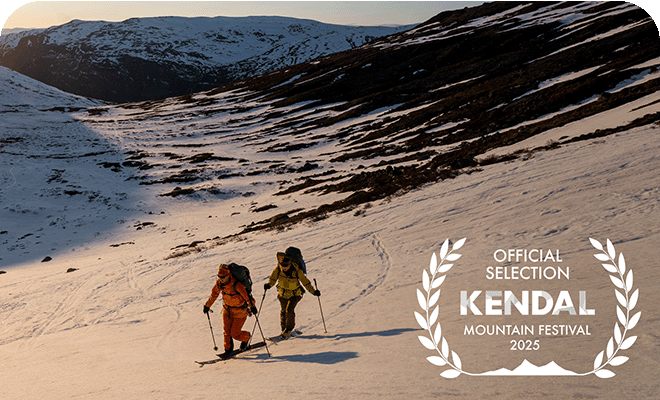 2 people skiing through the snowy alps