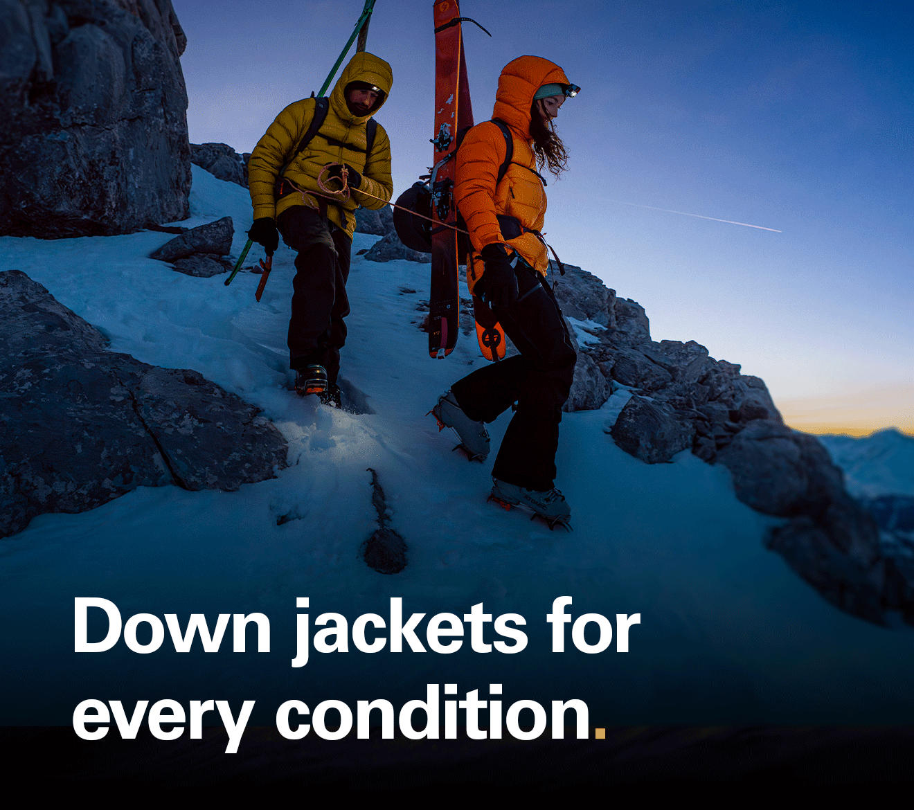 'Down jackets for every condition' text over an image of two skiers wearing down jackets on a mountain at dusk.