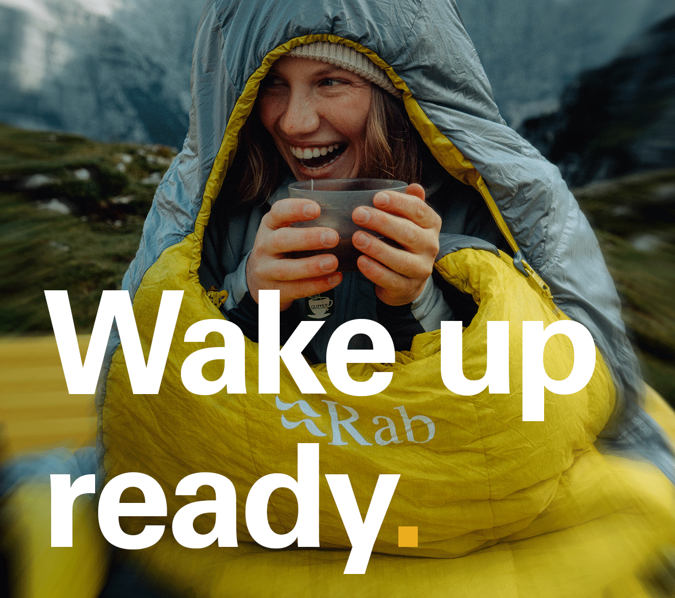 'Wake up ready.' Text over the image of a women wrapped up in a Rab sleeping bag.