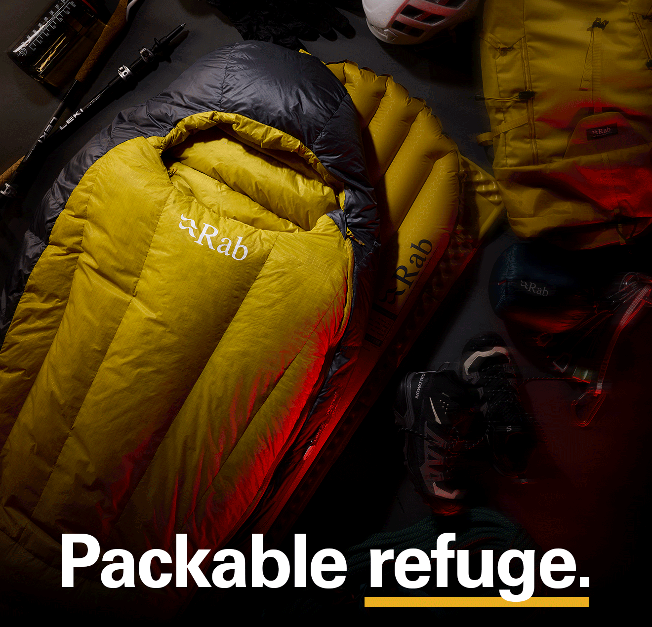 'Packable refuge' text written over the image of a set of Rab equipment including sleeping bags and sleeping mats.