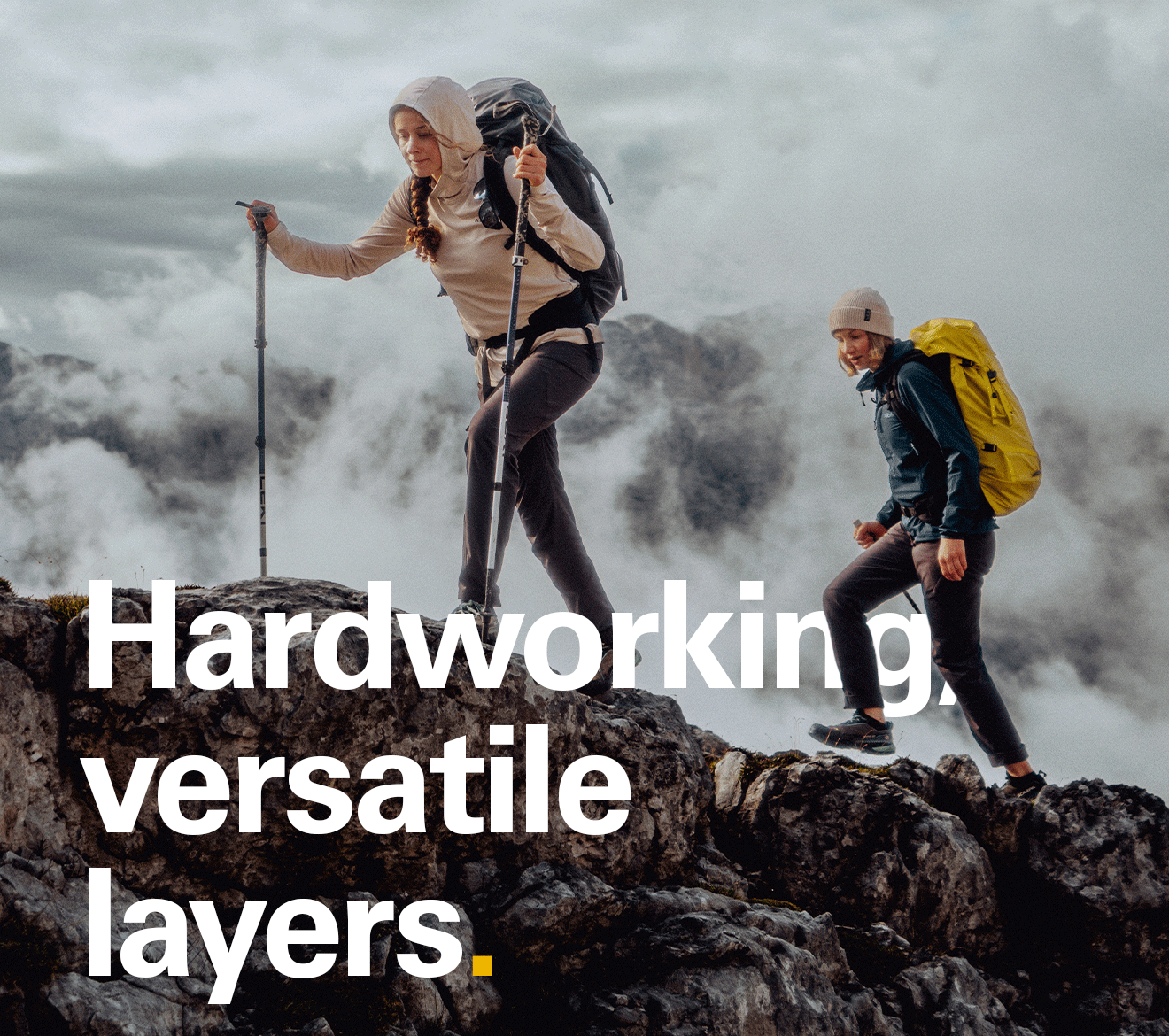 'Hardworking versatile layers' text over an image of 2 people mid hike.