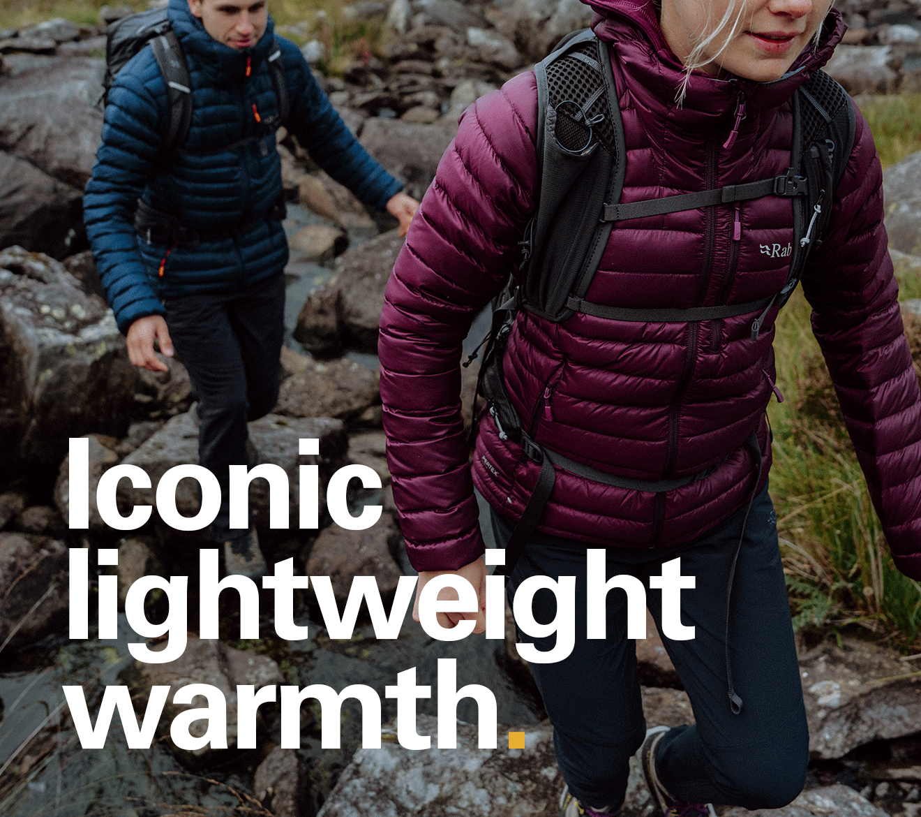 'Iconic lightweight warmth' text written over the image of 2 hikers walking up a trail both wearing Rab Microlight jackets.
