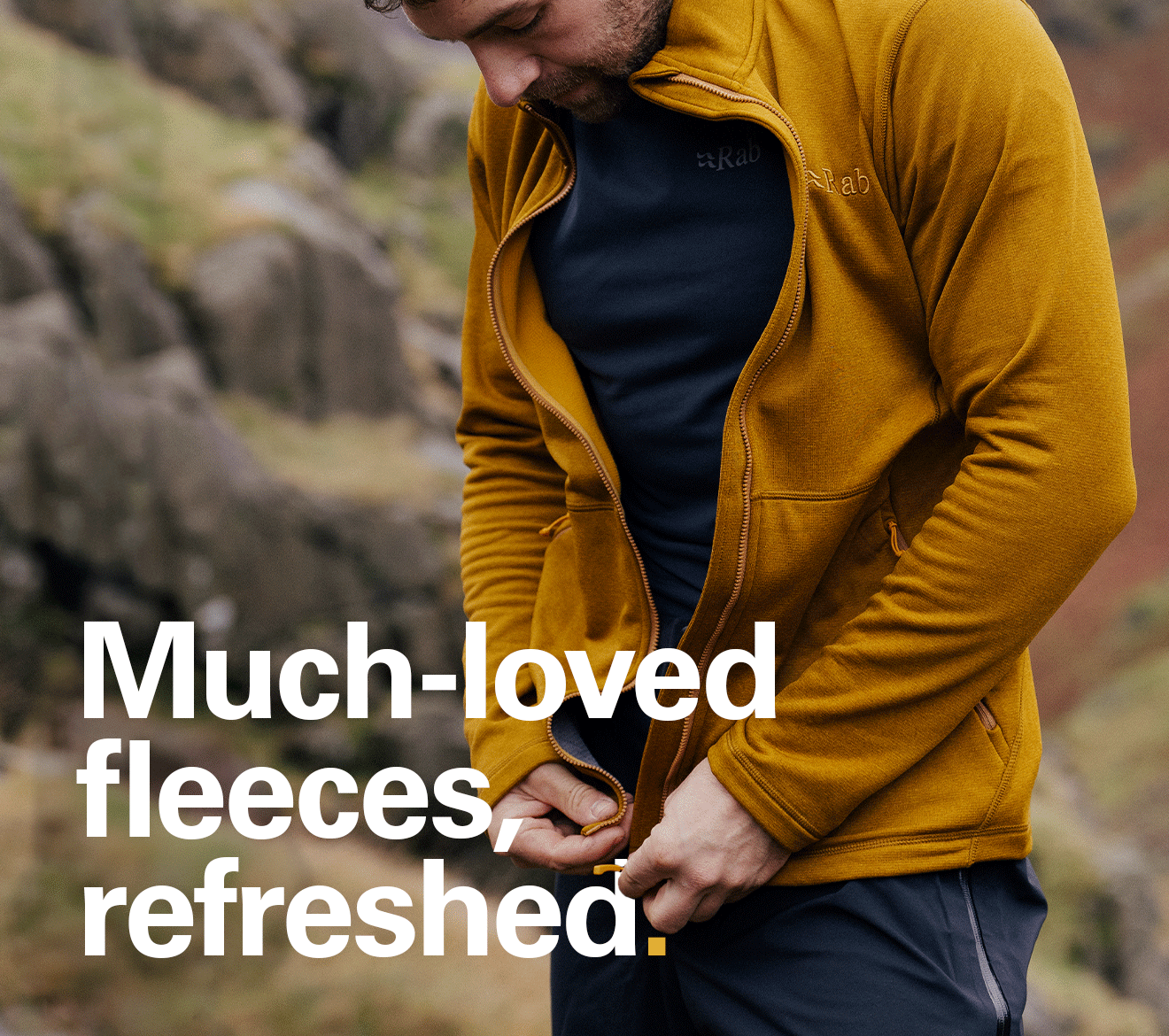 'Much-loved fleeces, refreshed.' Text on the image of a men zipping up a Rab fleece in the Hills.