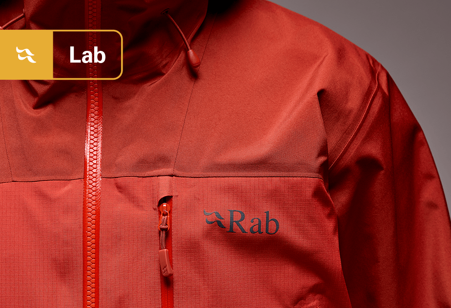 A closeup of a Rab Waterproof Jacket, made with pfas-free material