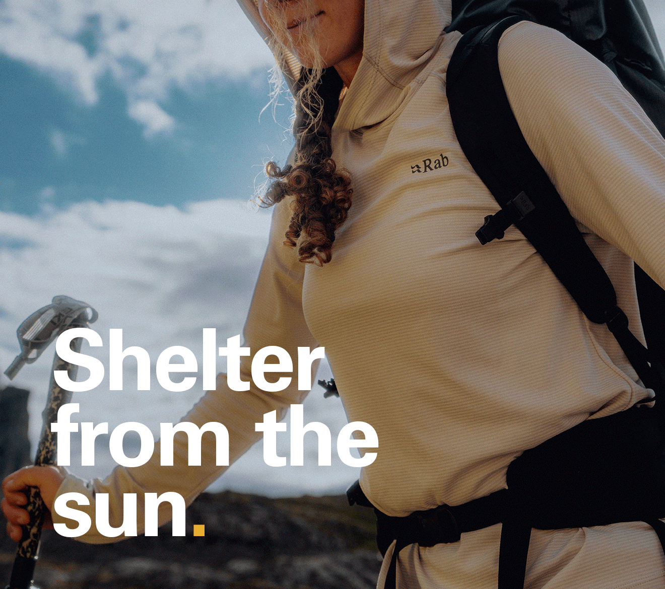 'Shelter from the sun' text over the image of a women on a hike in the sun wearing a Rab hoody.
