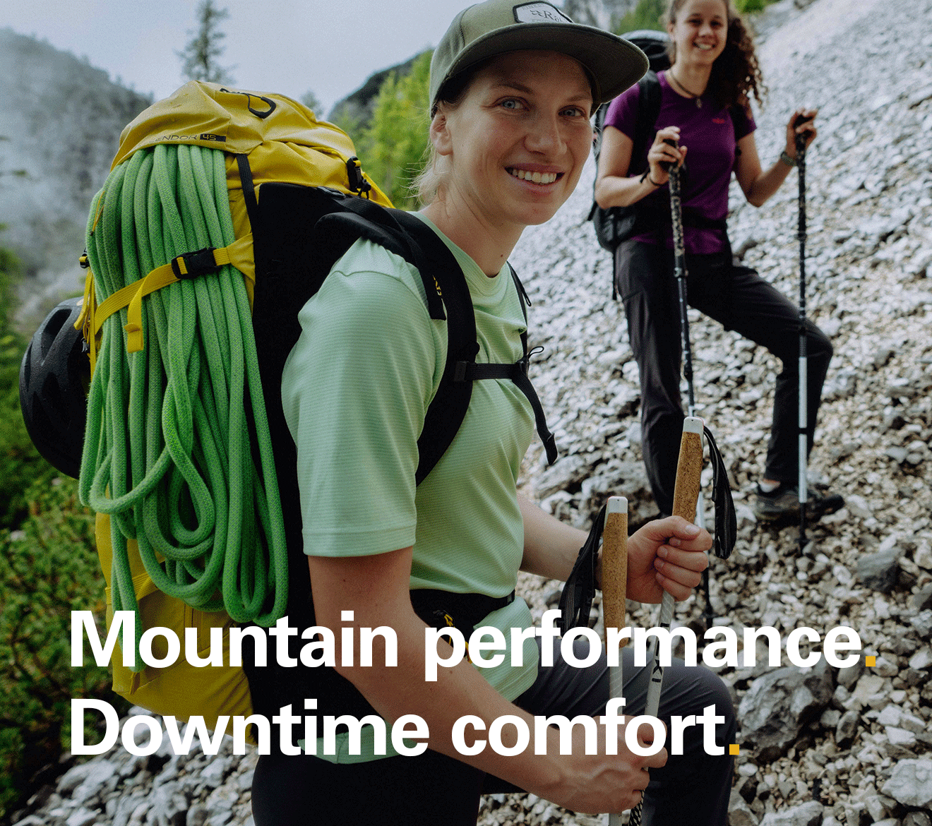 'Mountain performance. Downtime comfort' text on the image of two women on a trail wearing Rab tees.