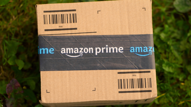 Amazon box sitting on a lawn. 