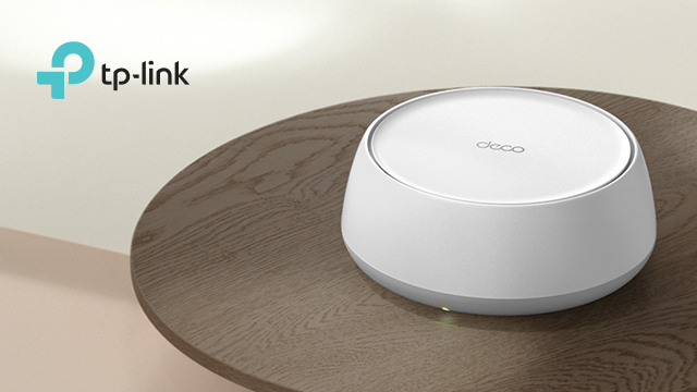 TP Link router on a small brown round side table.