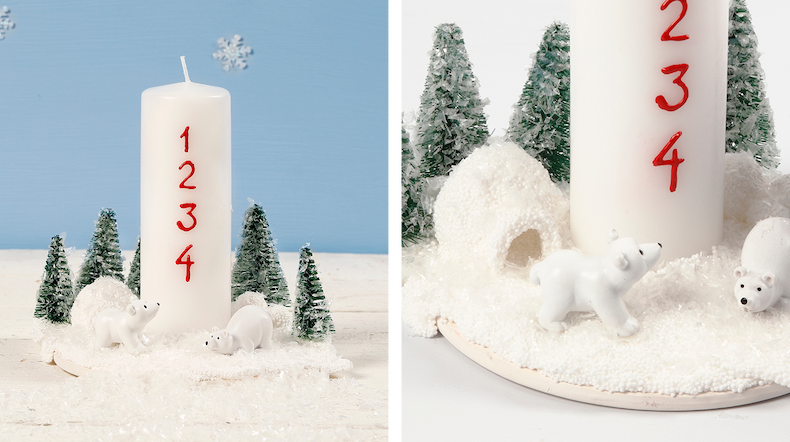 Christmas decoration with Advent candles decorated with polar bears and Christmas trees