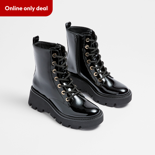 Cleat sole lace up boot