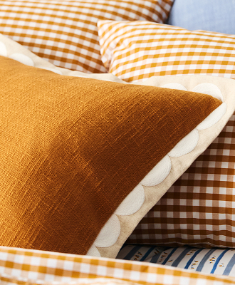 Scallop embroidered cushion