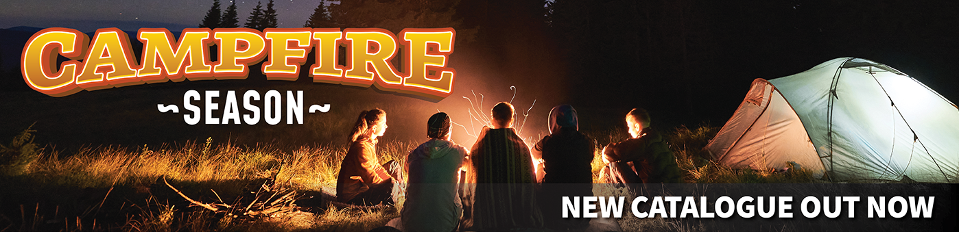a group of people standing around a campfire