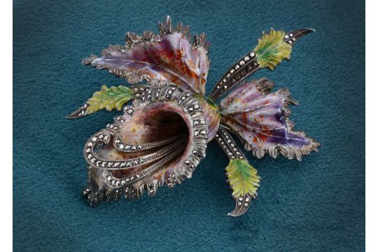 A large silver enamel and marcasite floral brooch