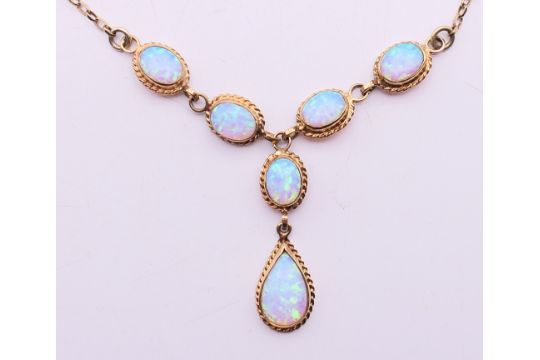 A 9 ct gold opal pendant necklace