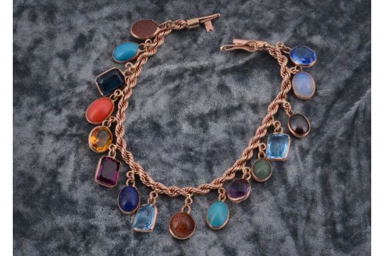 A multi gem set 9ct gold bracelet