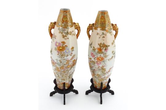 A pair of Japanese Satsuma style vases with twin handles