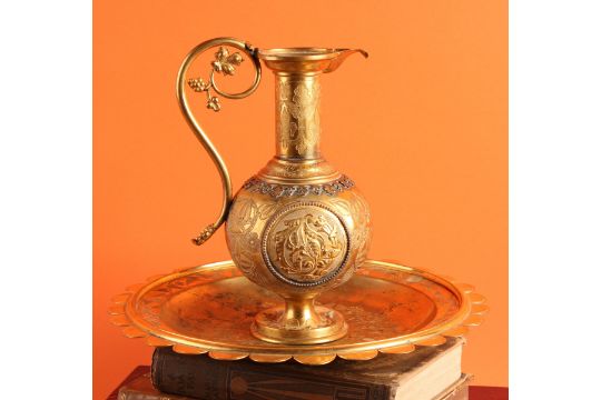 A 19th century Grecian Revival gilt metal ewer
