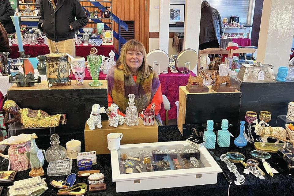 A seller at an antiques fair