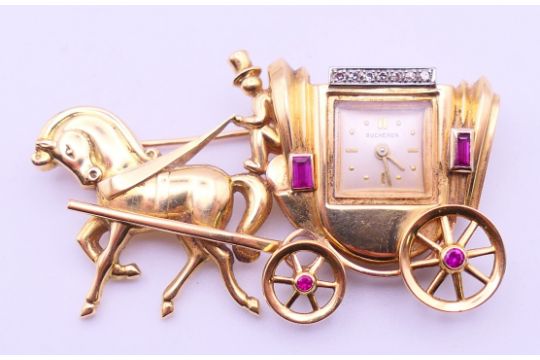 A Bucherer 18 ct gold, diamond and ruby horse and carriage…