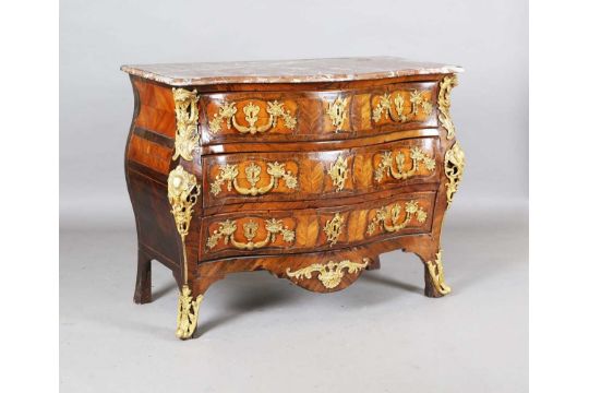 A 19th century Rococo Revival kingwood bombé commode