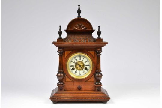 A late Victorian wooden mantle clock