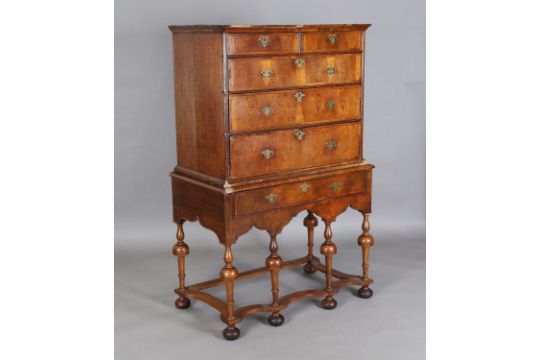 A George I walnut chest of oak-lined drawers
