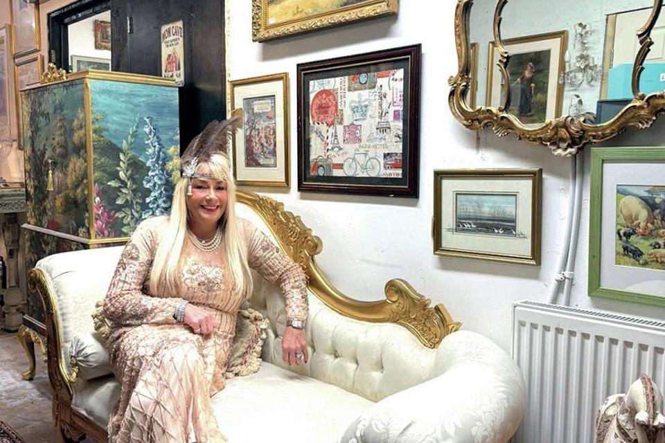 A dealer in their antiques shop