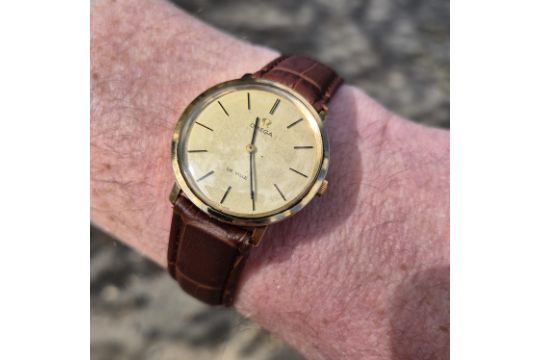 A Vintage 9ct Gold Omega De Ville Wristwatch. A Slim,…