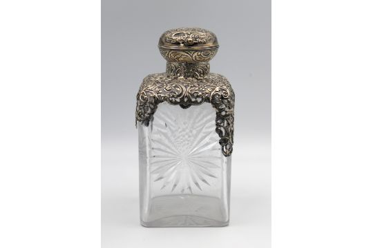 A Victorian silver mounted cut glass bottle