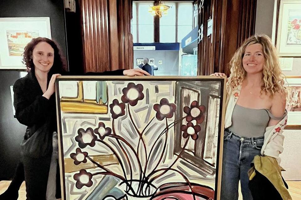 Two buyers at antiques fair