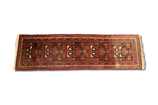 A hand-woven Afghan wool runner rug
