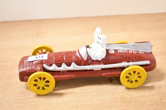 A Painted Cast Model Of Michelin Man In Vintage Racing…