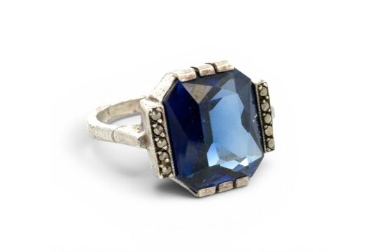 A synthetic sapphire and marcasite ring