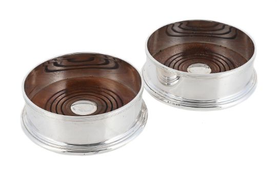 A Pair Of Scottish Silver Mounted Wine Coasters