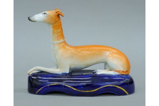A circa 1860 Staffordshire porcelain greyhound