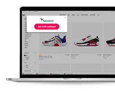 Laptop with TopCashback browser extension pop-up appearing in a retailer's website