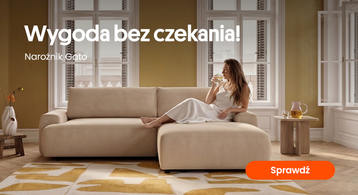 Woman in white dress seated on beige Gato corner sofa in bright living room, sipping drink on chaise, modern rug and side table