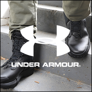 an image of a man wearing black boots and a white under armour logo