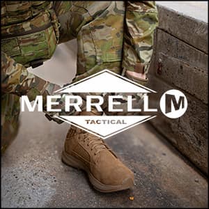 an image of a man in camouflages tying up a pair of shoes