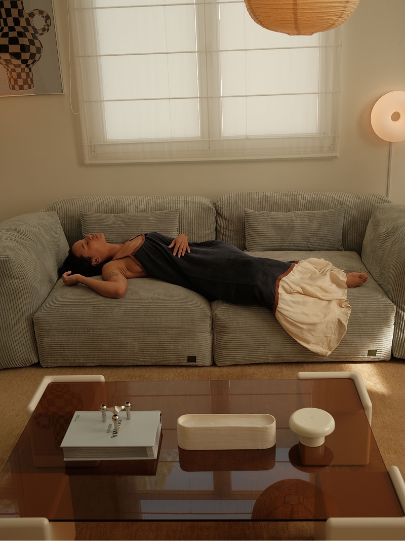 lady lounging on a vetsak sofa