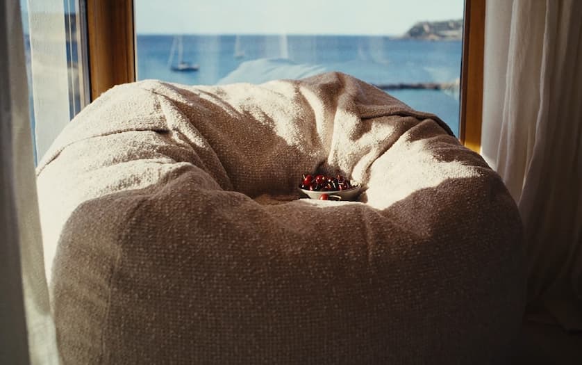 pique wheat outdoor sofa with sunset